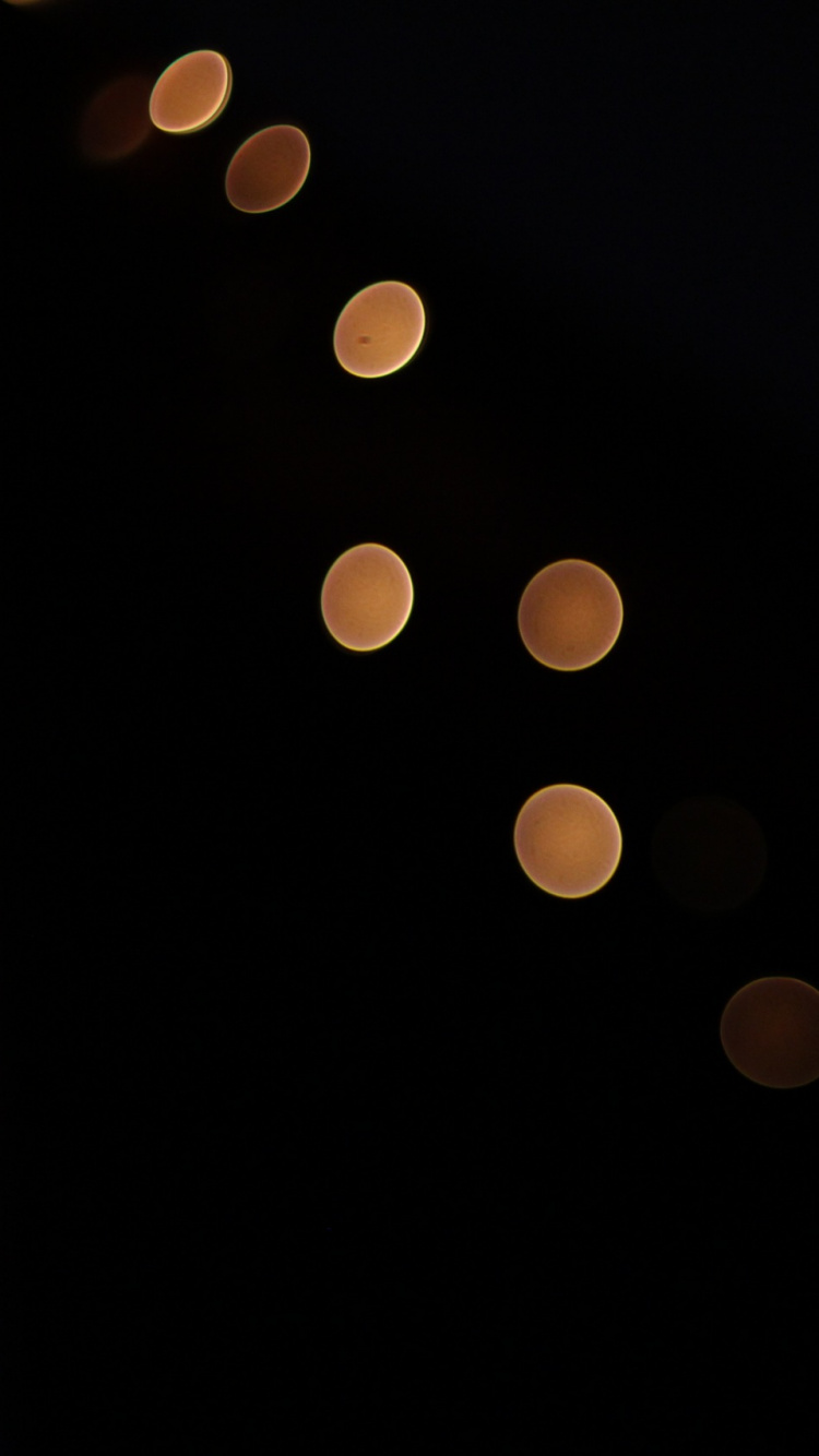 Yellow Lights on Black Background. Wallpaper in 750x1334 Resolution