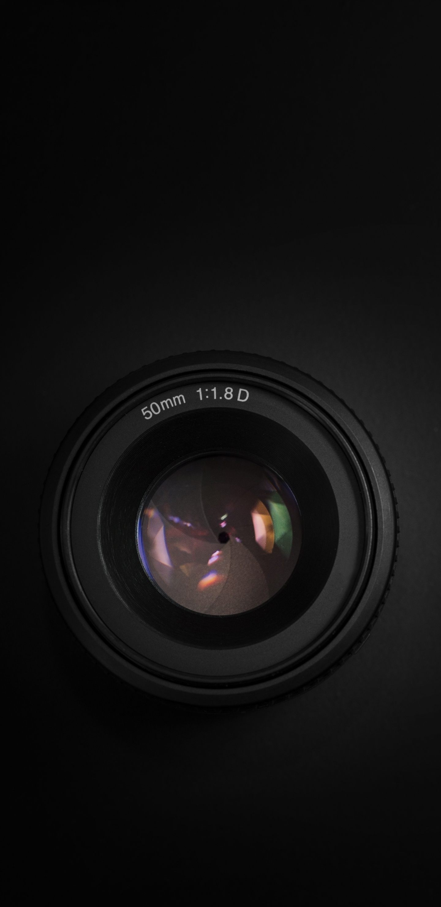 Black Camera Lens on Black Surface. Wallpaper in 1440x2960 Resolution