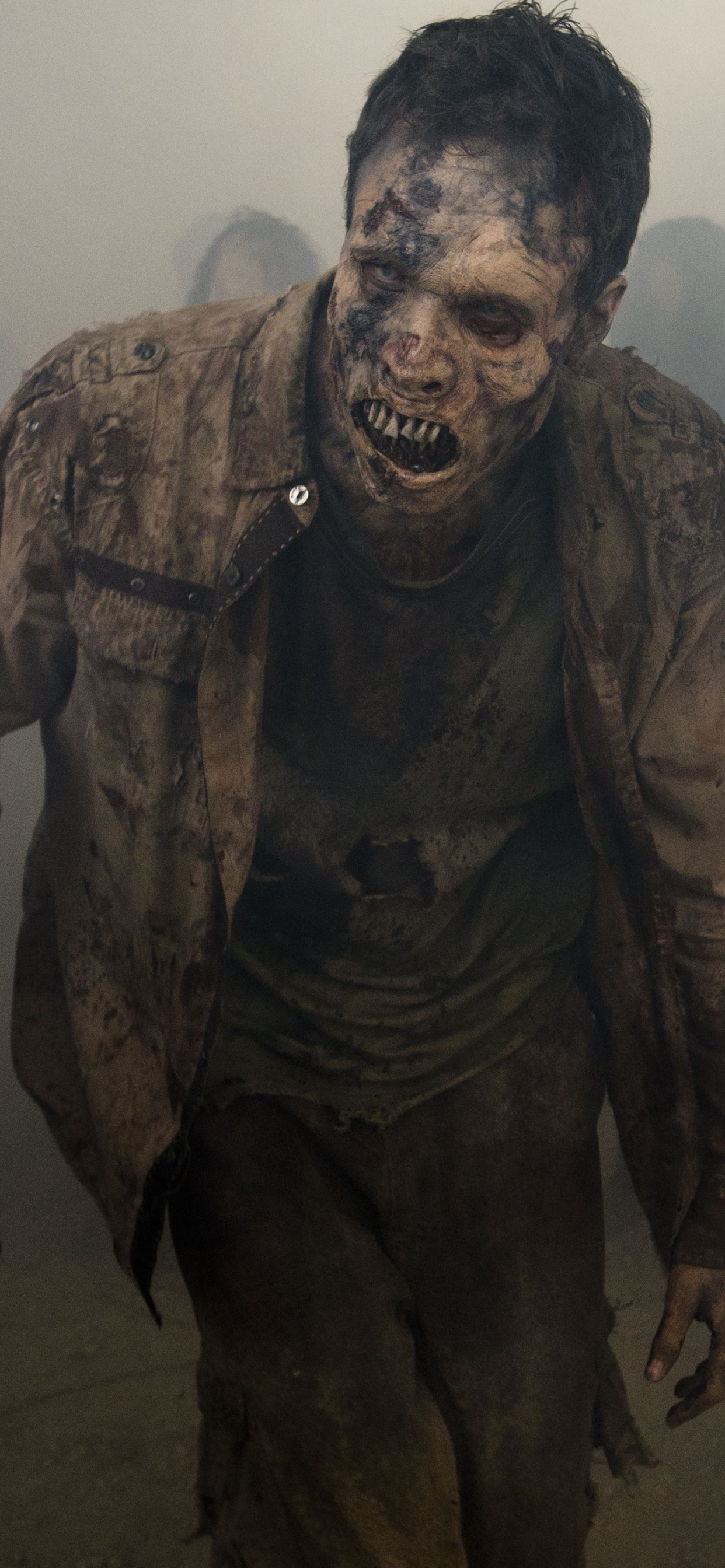 Man in Black and Brown Camouflage Suit. Wallpaper in 1242x2688 Resolution