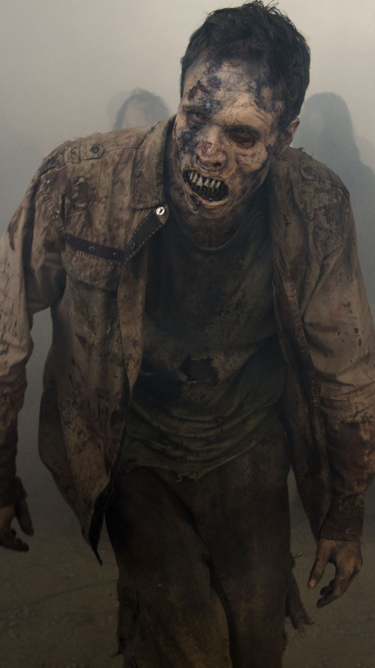 Man in Black and Brown Camouflage Suit. Wallpaper in 750x1334 Resolution