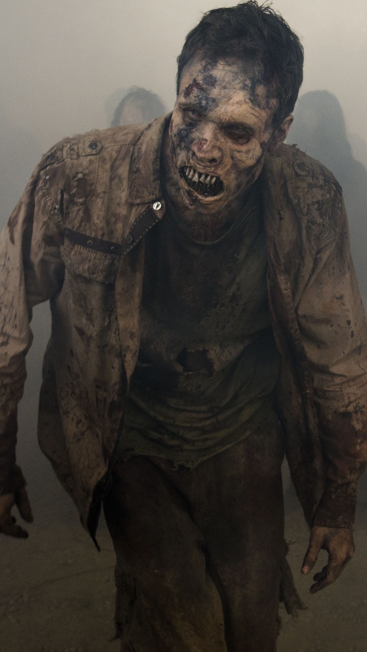 Homme en Costume de Camouflage Noir et Marron. Wallpaper in 720x1280 Resolution