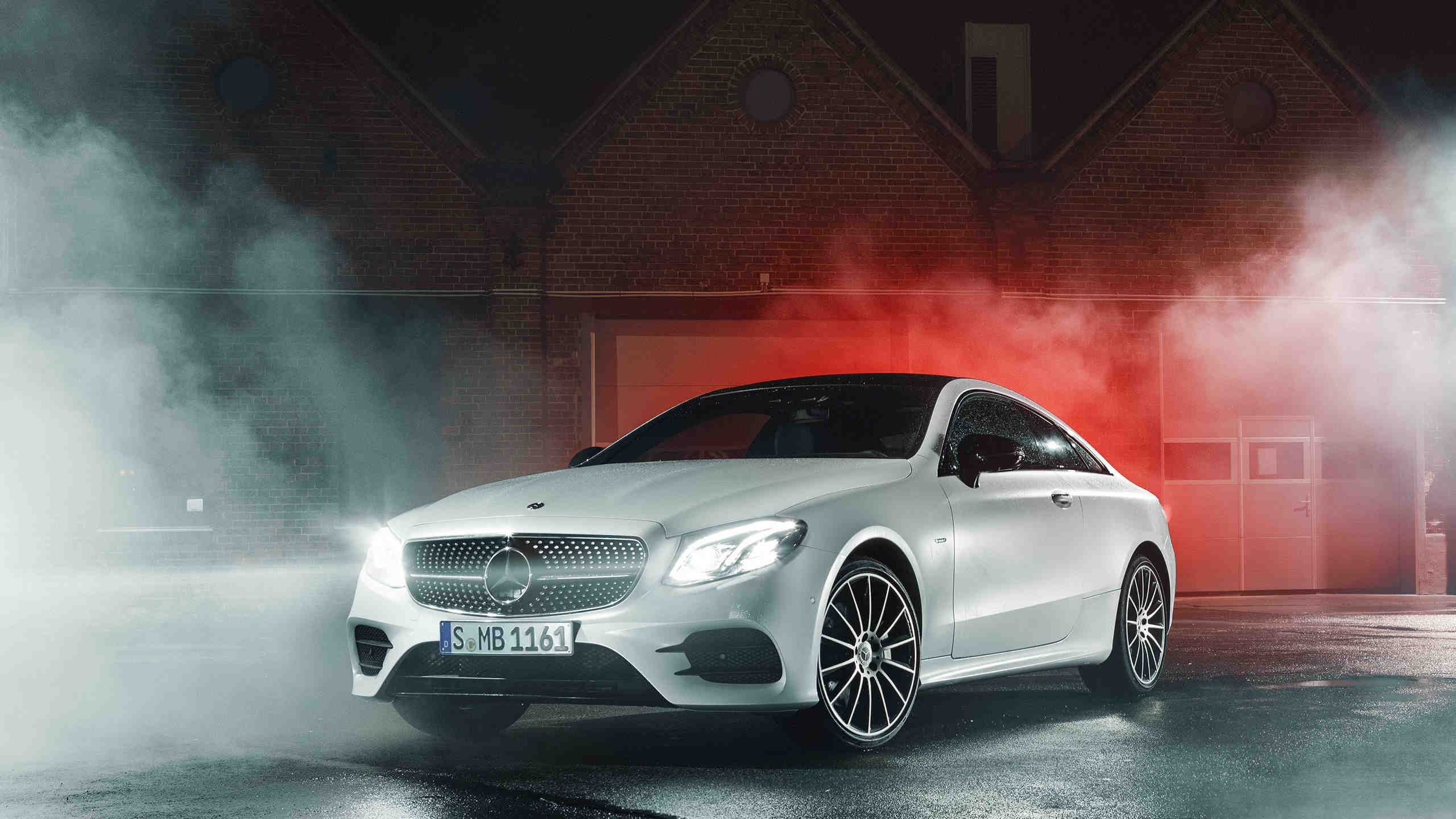 White Mercedes Benz Coupe Parked Beside Red Wall. Wallpaper in 2560x1440 Resolution