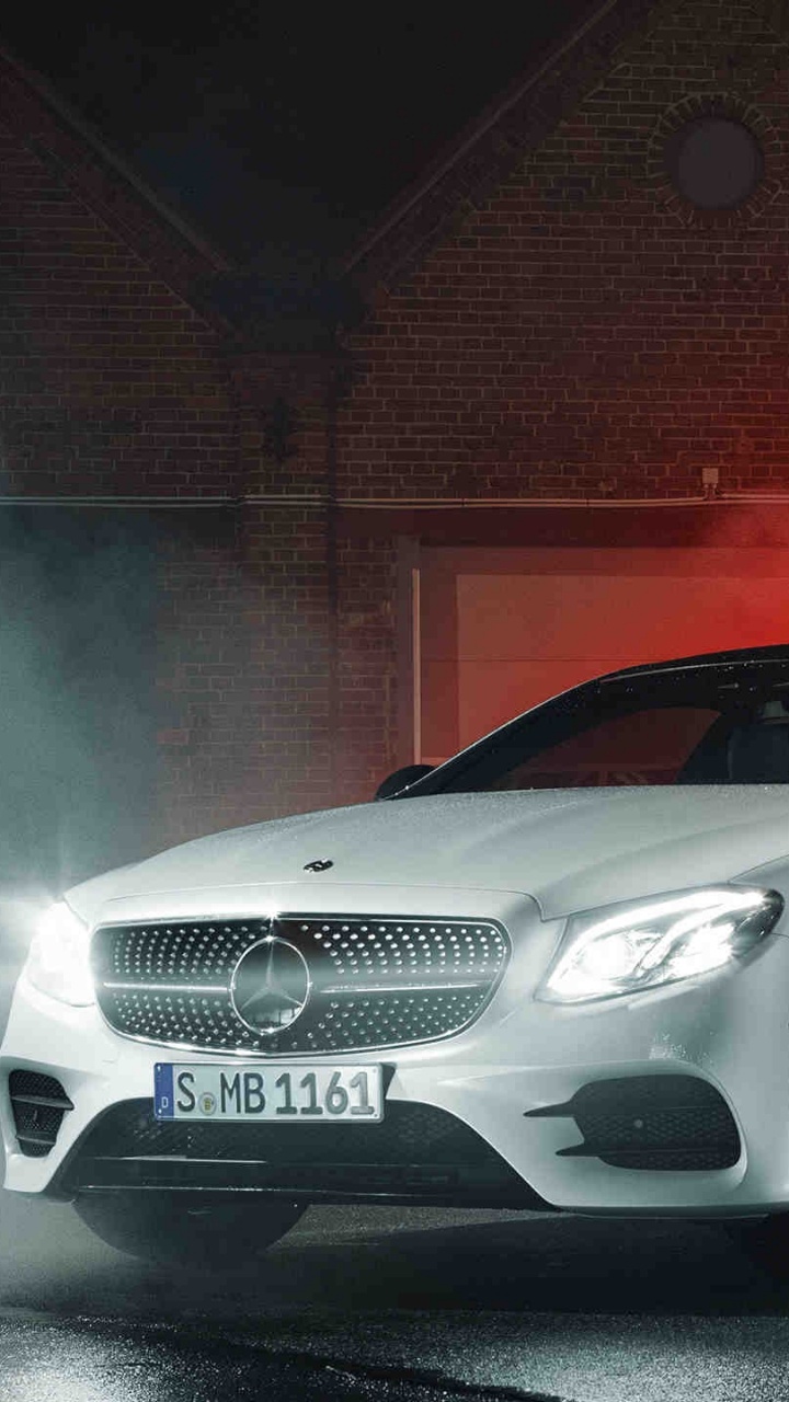 White Mercedes Benz Coupe Parked Beside Red Wall. Wallpaper in 720x1280 Resolution
