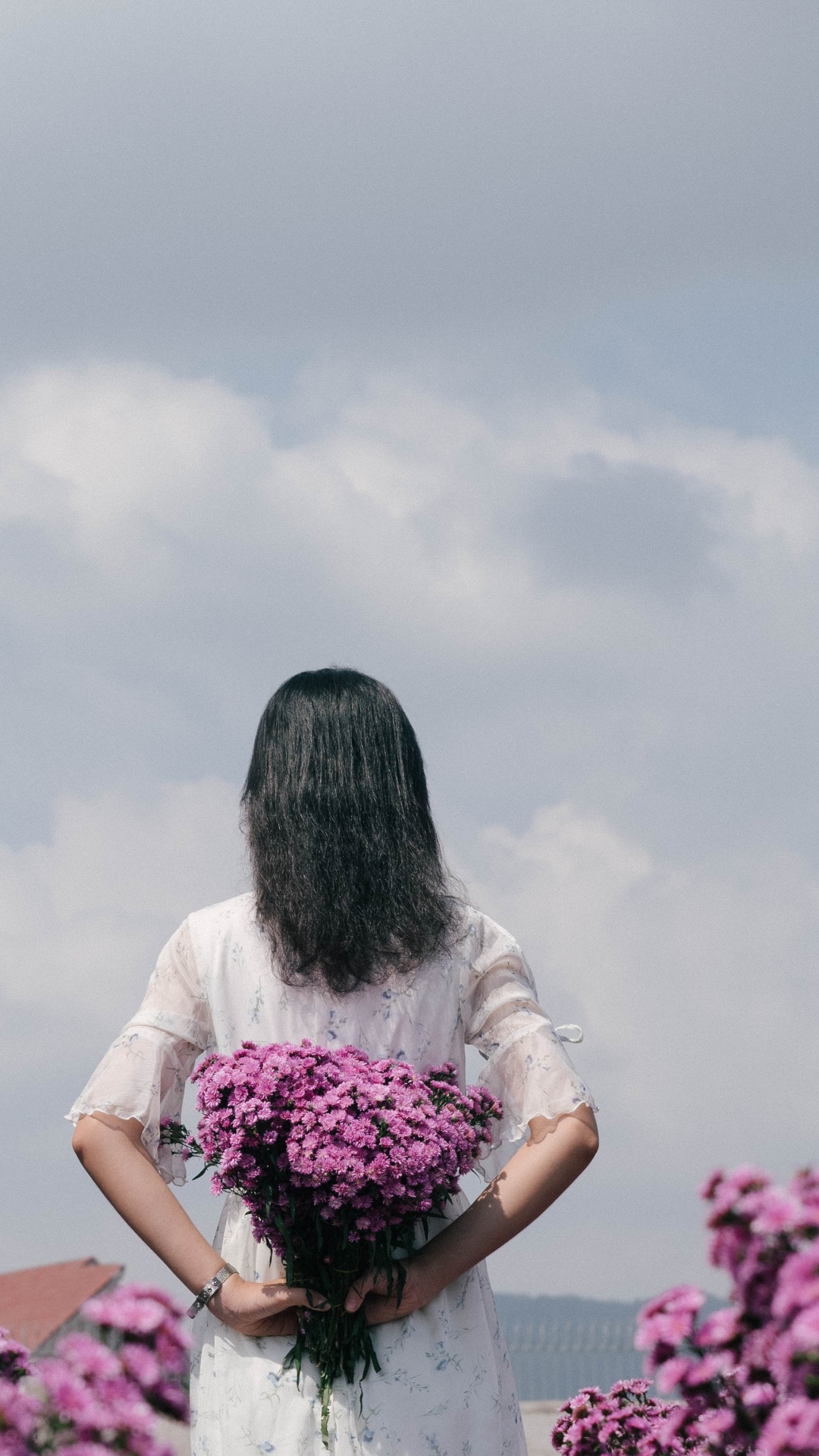 Woman in White Shirt Holding Pink Flower Bouquet. Wallpaper in 1080x1920 Resolution