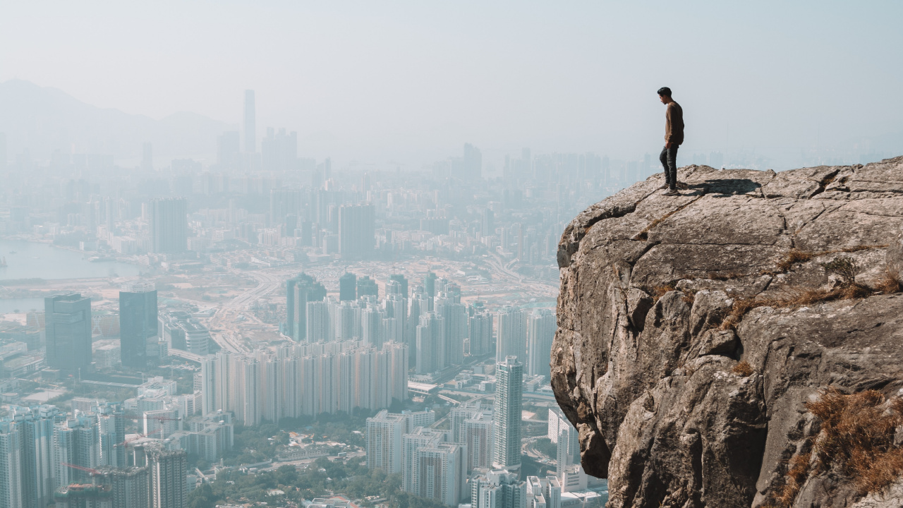 Man Standing on Rock Formation During Daytime. Wallpaper in 1280x720 Resolution