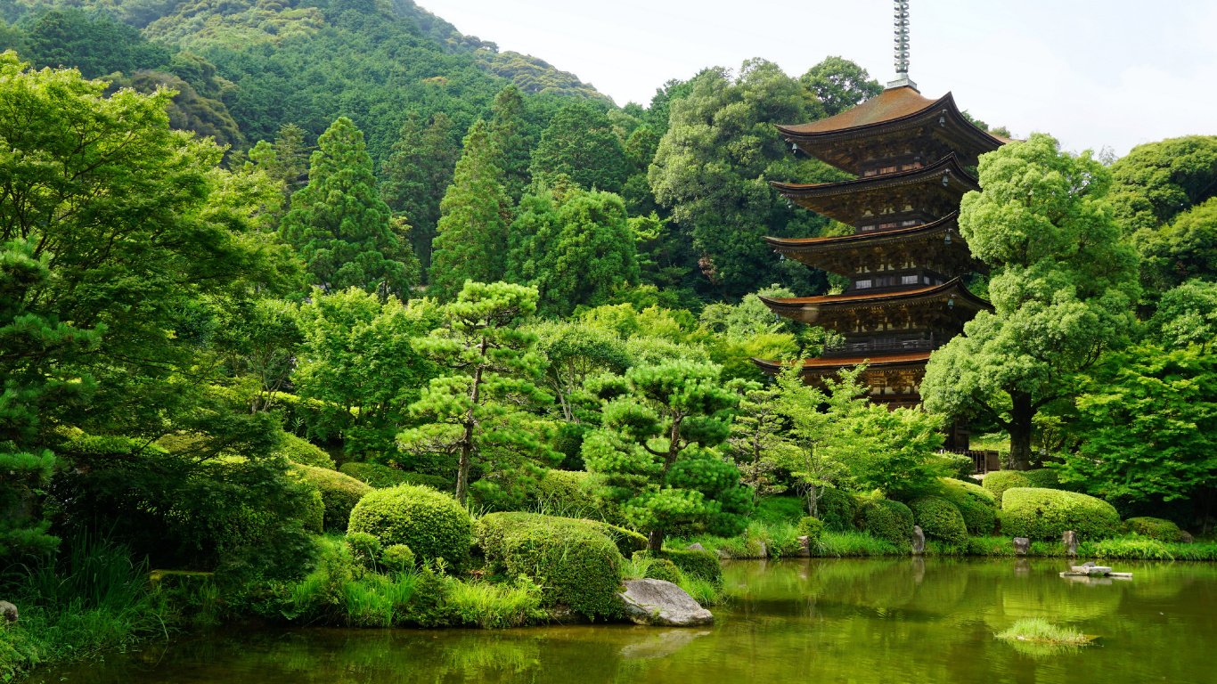 Brown Temple Near Green Trees and Lake During Daytime. Wallpaper in 1366x768 Resolution