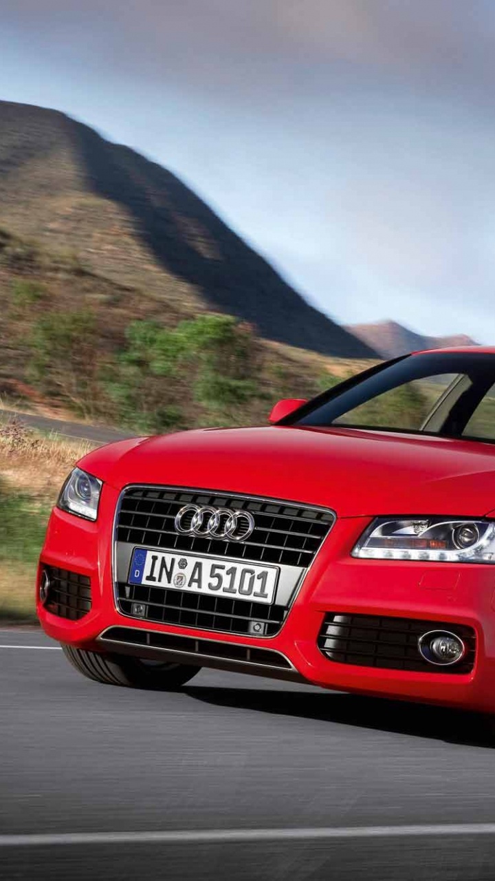 Audi Coupe Rojo en la Carretera Durante el Día. Wallpaper in 720x1280 Resolution