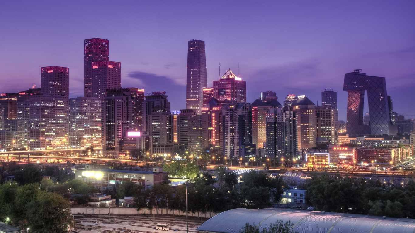 City Buildings With Lights Turned on During Night Time. Wallpaper in 1366x768 Resolution