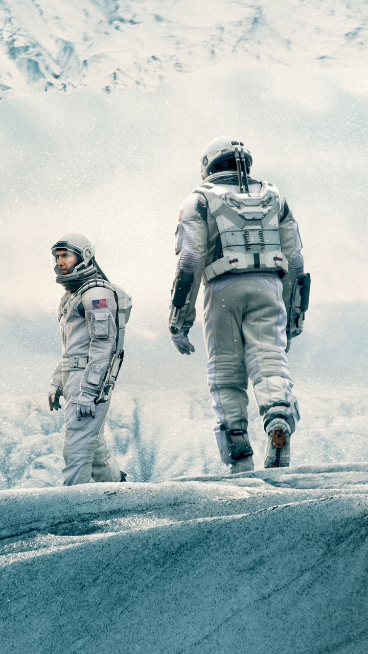 Man in Black and White Jacket and Black Pants Standing on Snow Covered Mountain During Daytime. Wallpaper in 720x1280 Resolution