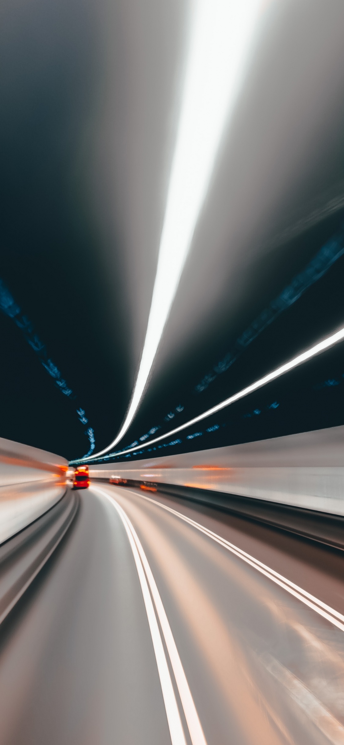 White and Blue Light in a Tunnel. Wallpaper in 1125x2436 Resolution