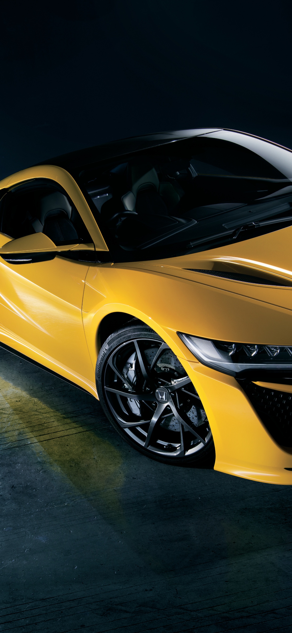 Yellow Ferrari 458 Italia Parked on Black Floor. Wallpaper in 1242x2688 Resolution