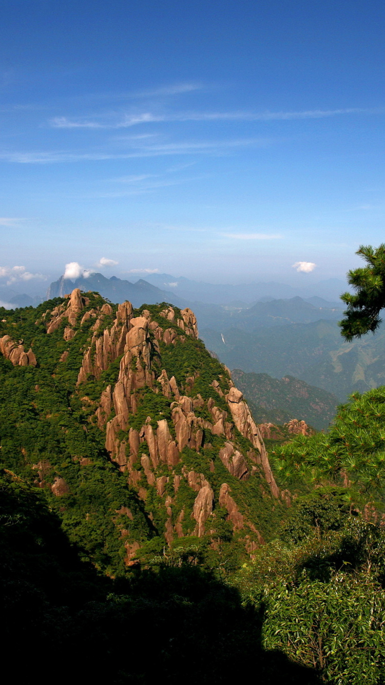 Green Trees on Brown Mountain Under Blue Sky During Daytime. Wallpaper in 750x1334 Resolution