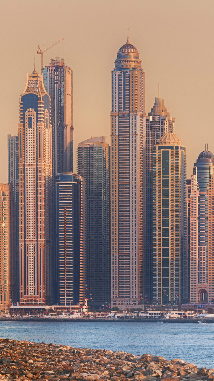 High Rise Buildings Near Body of Water During Daytime. Wallpaper in 750x1334 Resolution