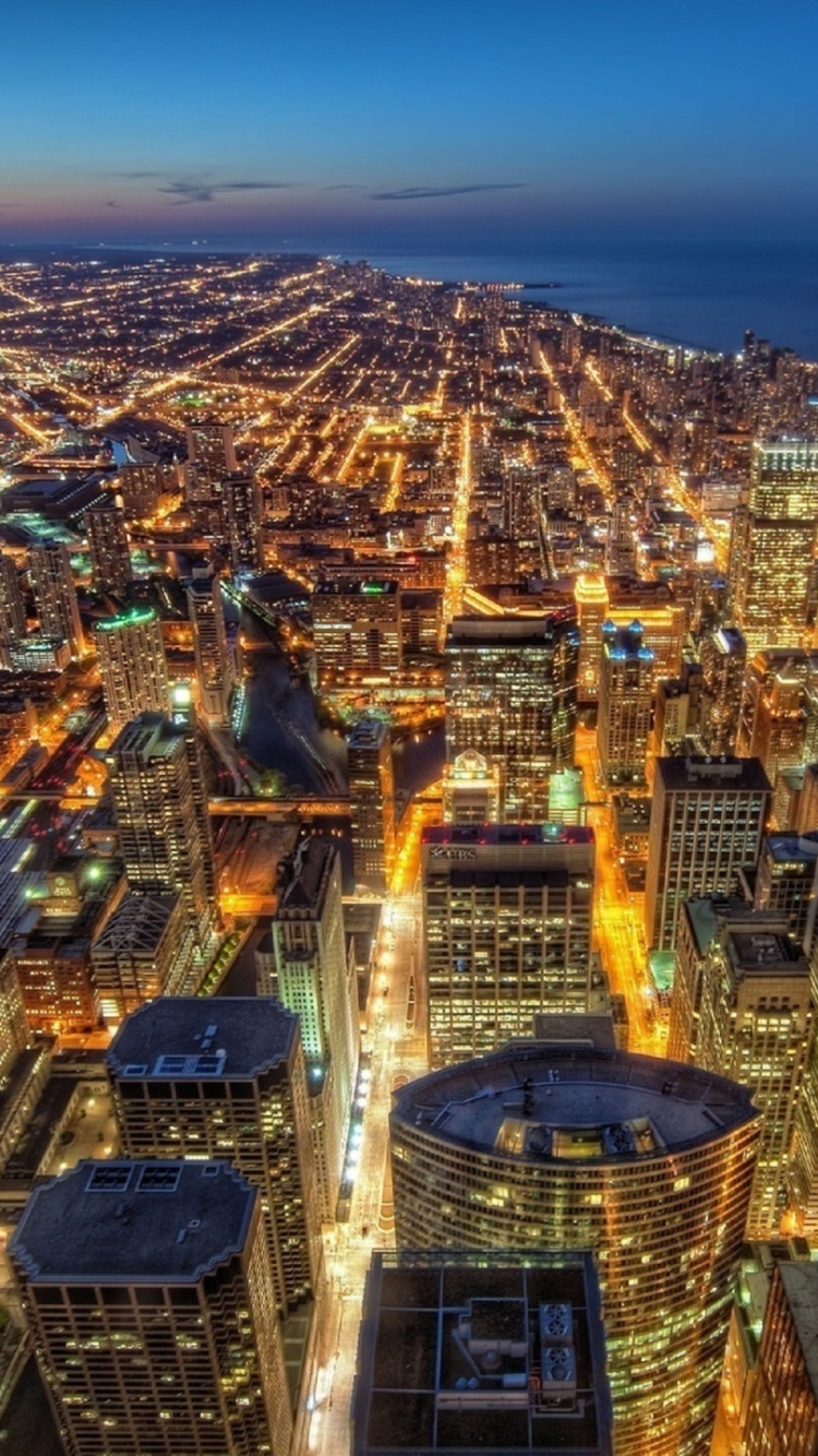 Aerial View of City Buildings During Night Time. Wallpaper in 750x1334 Resolution