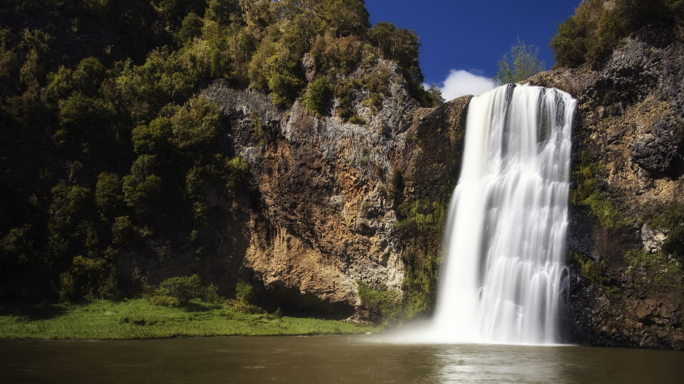 Waterfalls Near Green Trees Under Blue Sky During Daytime. Wallpaper in 1366x768 Resolution