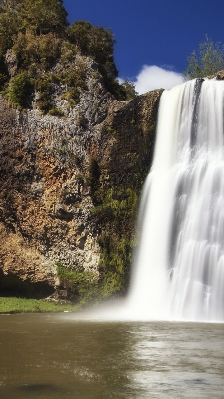 Waterfalls Near Green Trees Under Blue Sky During Daytime. Wallpaper in 720x1280 Resolution