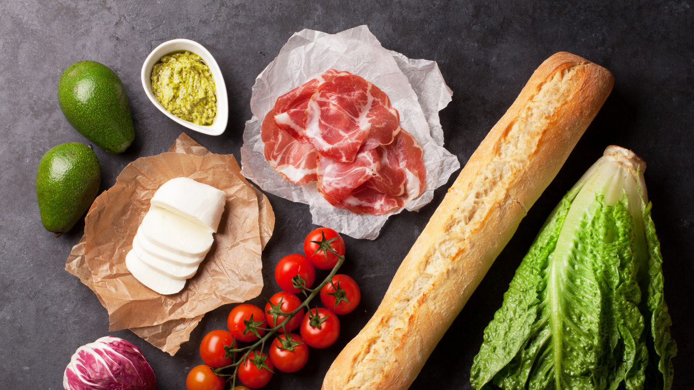 Red Tomato Beside Brown Bread and Green Vegetable. Wallpaper in 1366x768 Resolution