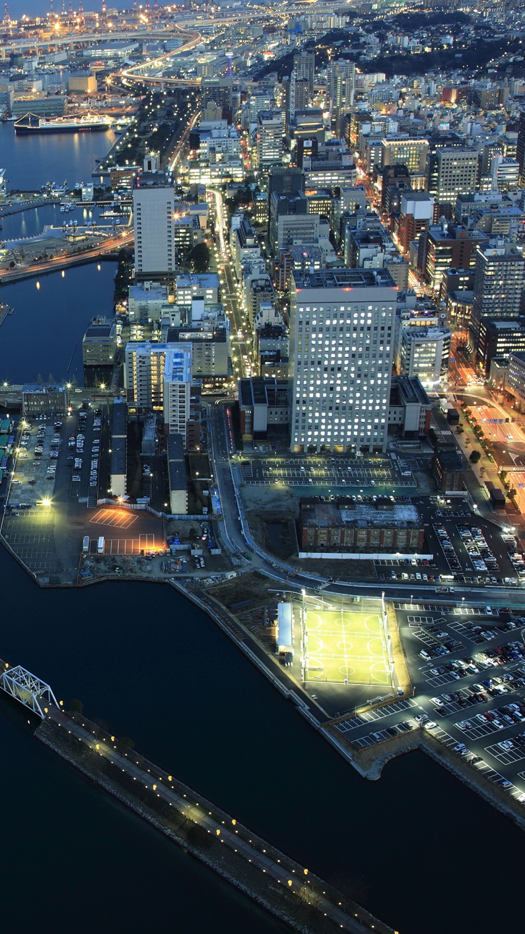 Vista Aérea de Los Edificios de la Ciudad Durante la Noche.. Wallpaper in 1080x1920 Resolution