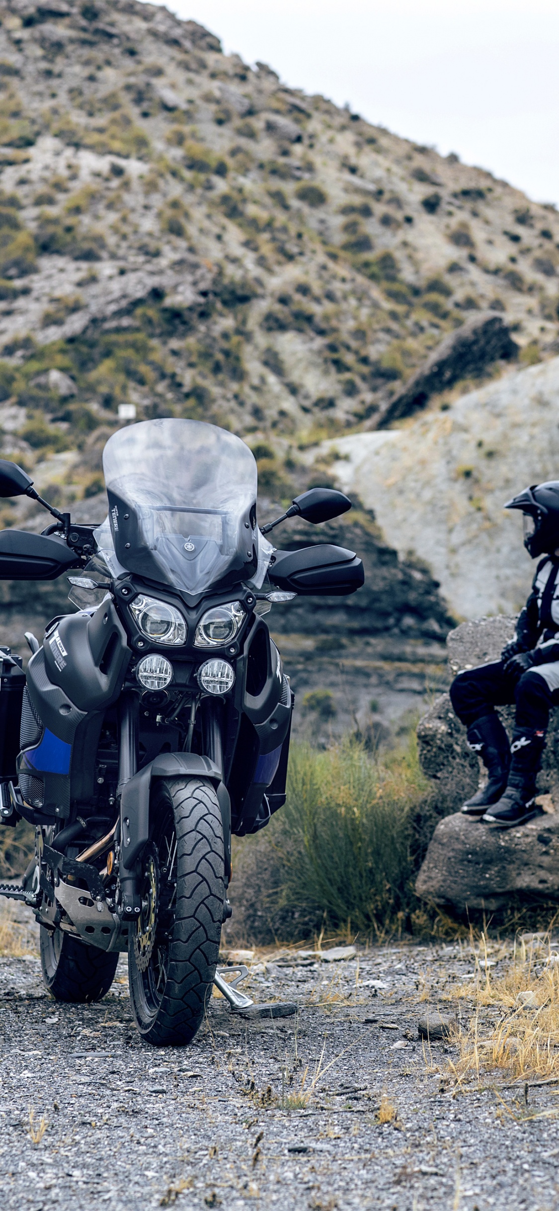 Man in Black Jacket Riding Black Motorcycle on Gray Road During Daytime. Wallpaper in 1125x2436 Resolution