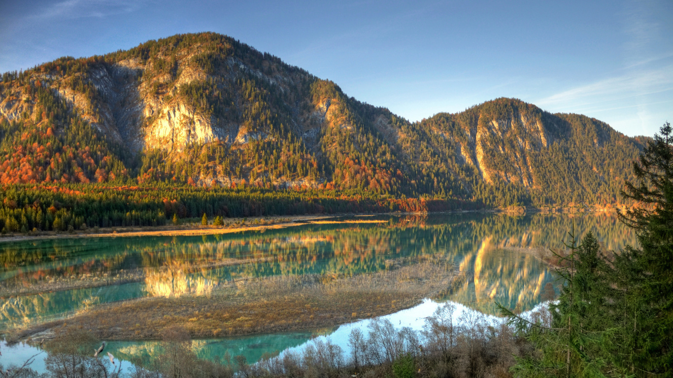 Brown Mountain Beside Body of Water During Daytime. Wallpaper in 1366x768 Resolution