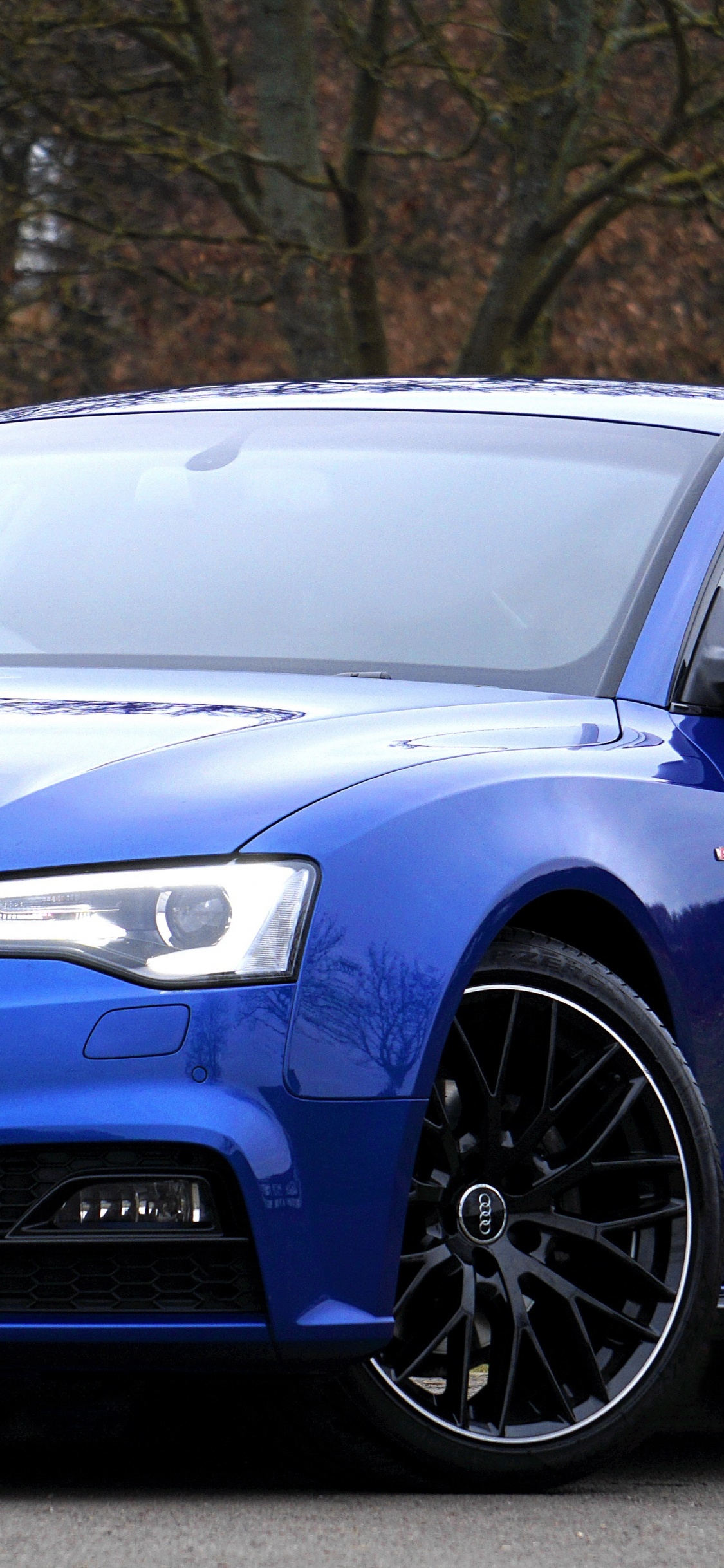 Blue Audi a 4 Coupe. Wallpaper in 1125x2436 Resolution