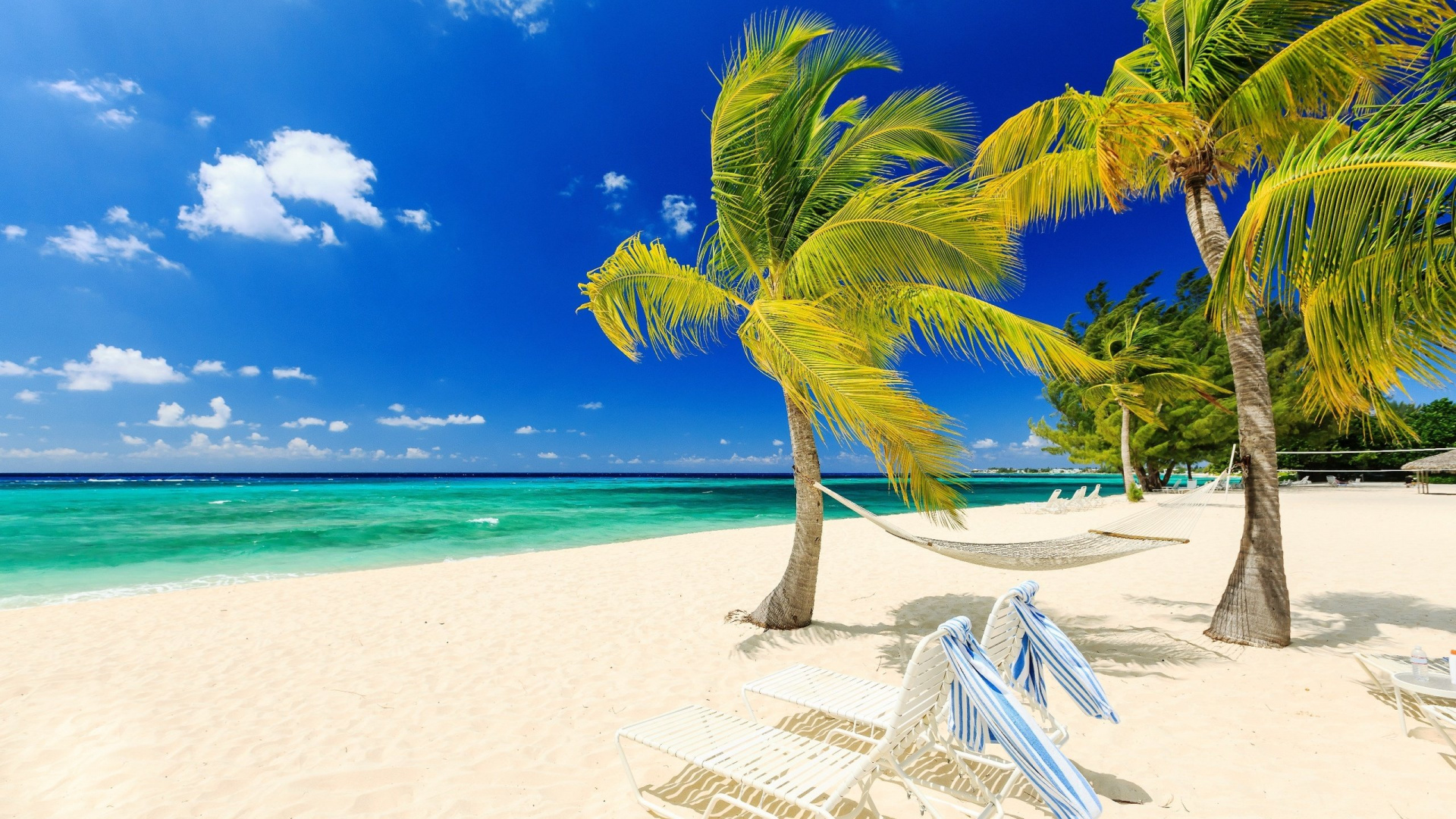 White Beach Lounge Chairs on Beach During Daytime. Wallpaper in 1920x1080 Resolution