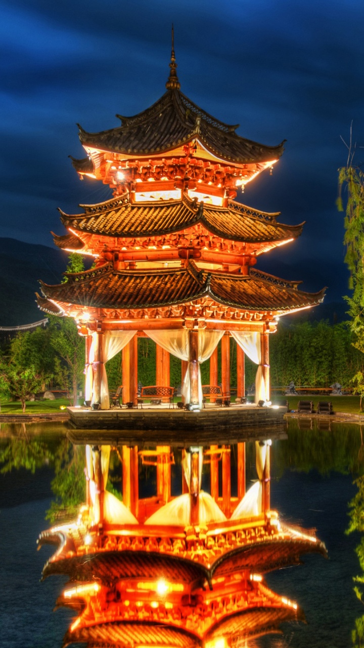 Brown Pagoda Temple Near Green Trees and Lake During Daytime. Wallpaper in 720x1280 Resolution