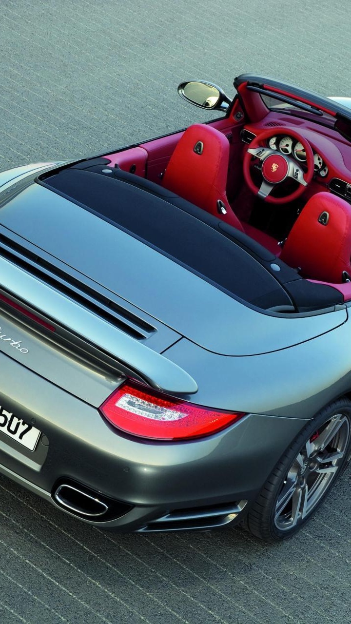 Schwarz-roter Porsche 911 Unterwegs. Wallpaper in 720x1280 Resolution