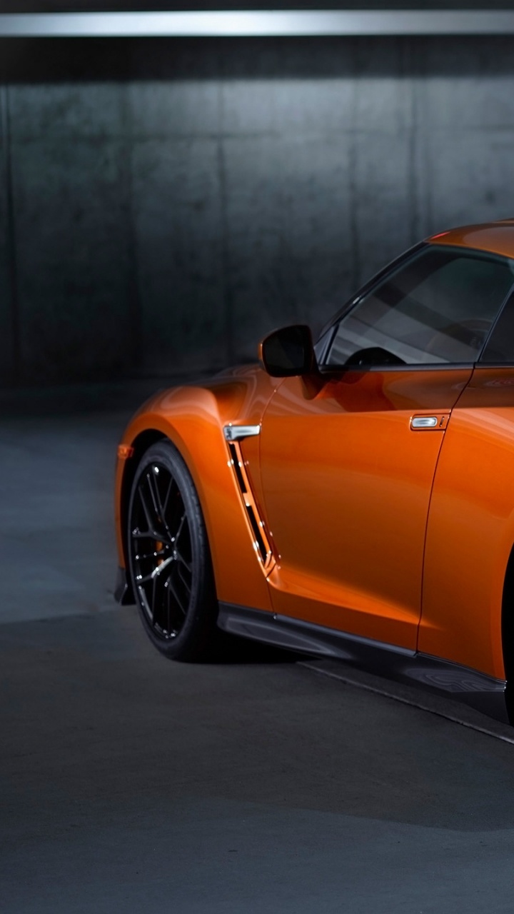 Orange Mercedes Benz Coupe Parked on Parking Lot. Wallpaper in 720x1280 Resolution