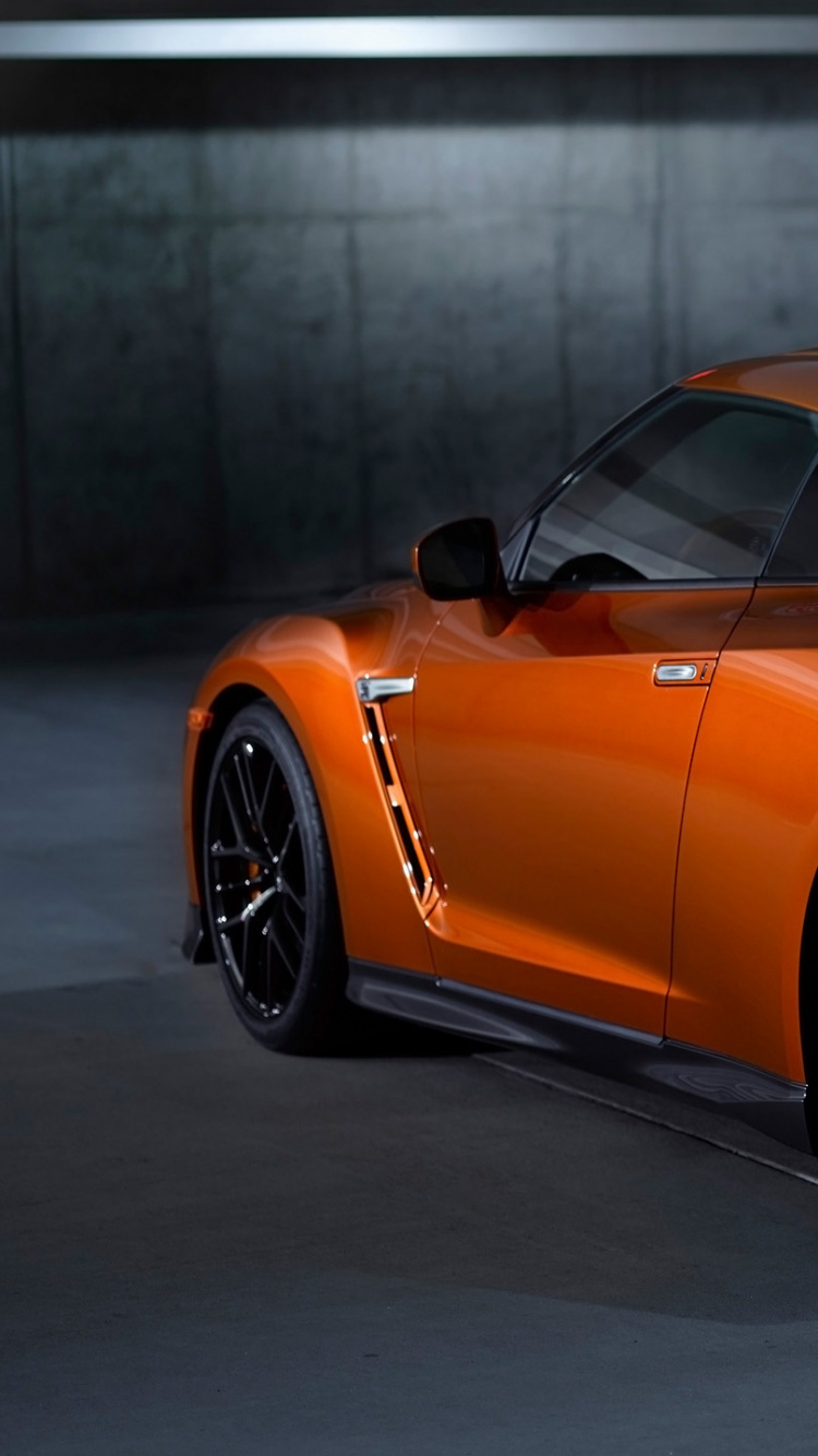 Orange Mercedes Benz Coupe Parked on Parking Lot. Wallpaper in 750x1334 Resolution