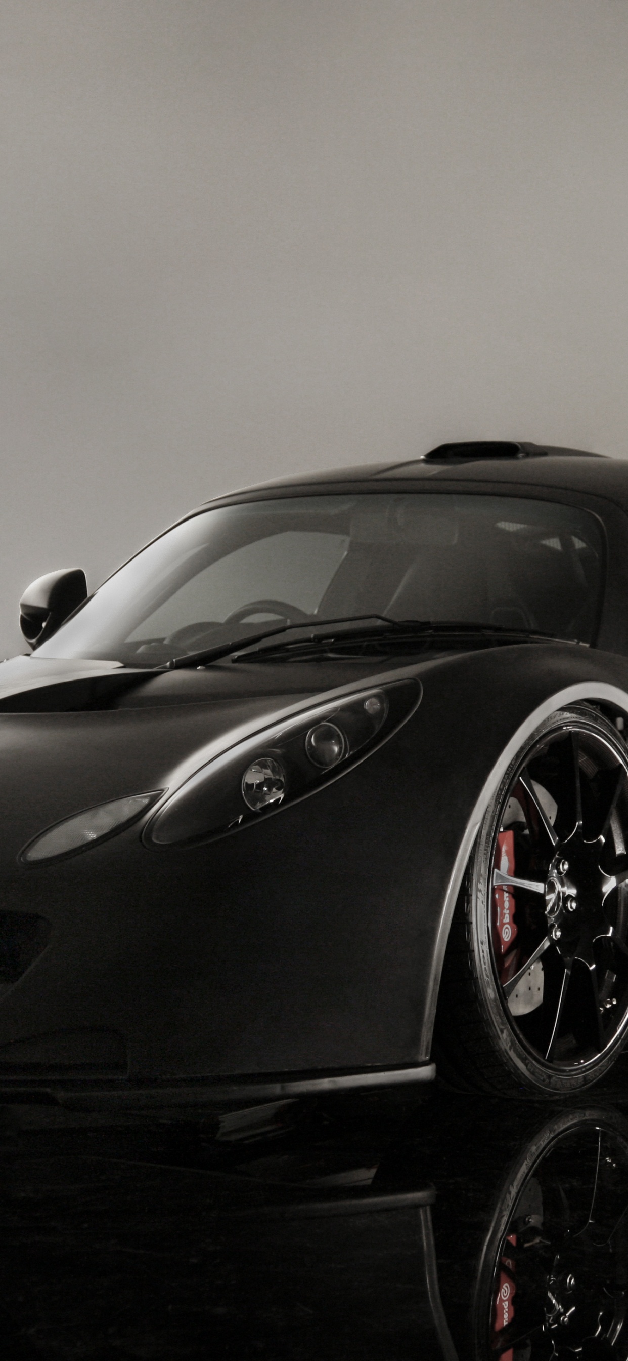 Black Lamborghini Aventador in a Gray Room. Wallpaper in 1242x2688 Resolution