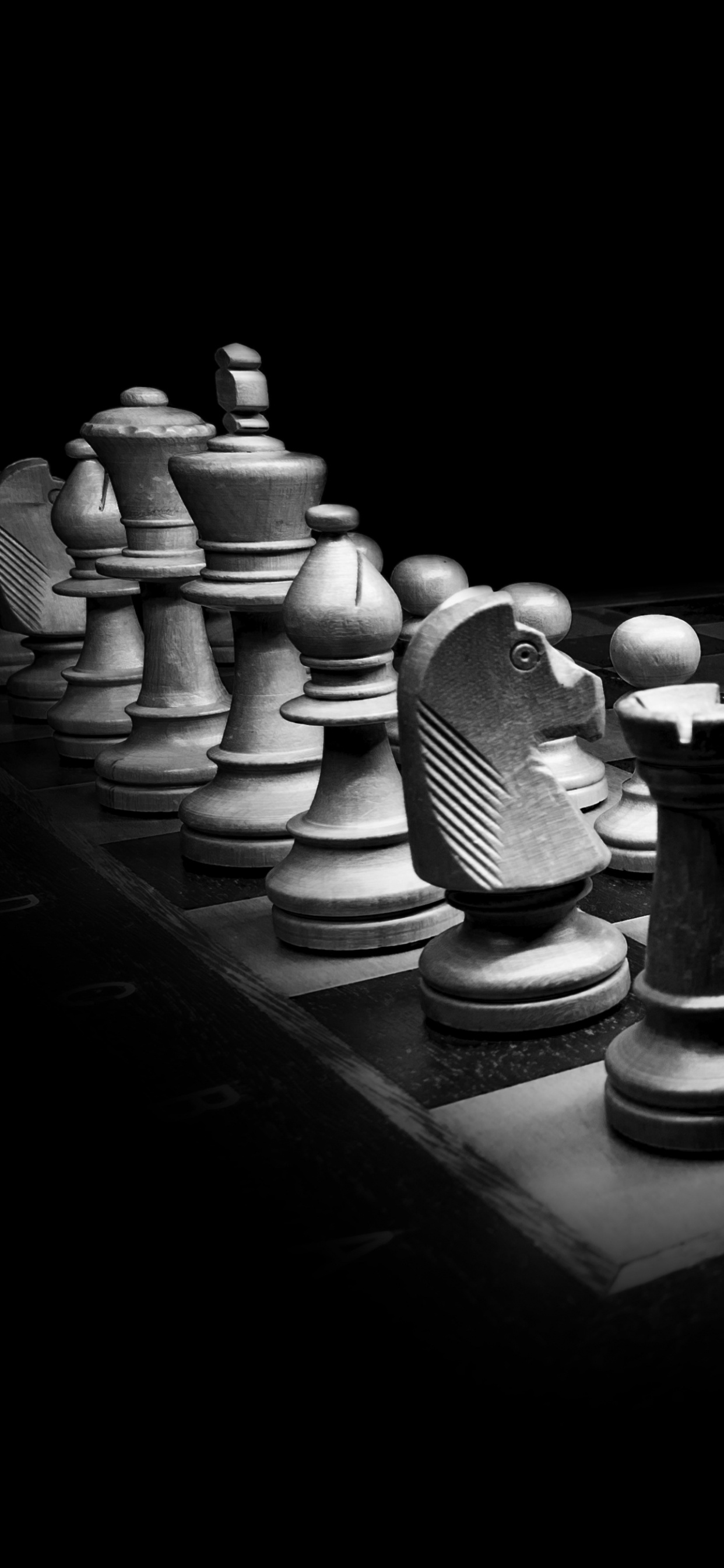 Chess Pieces on Chess Board. Wallpaper in 1242x2688 Resolution