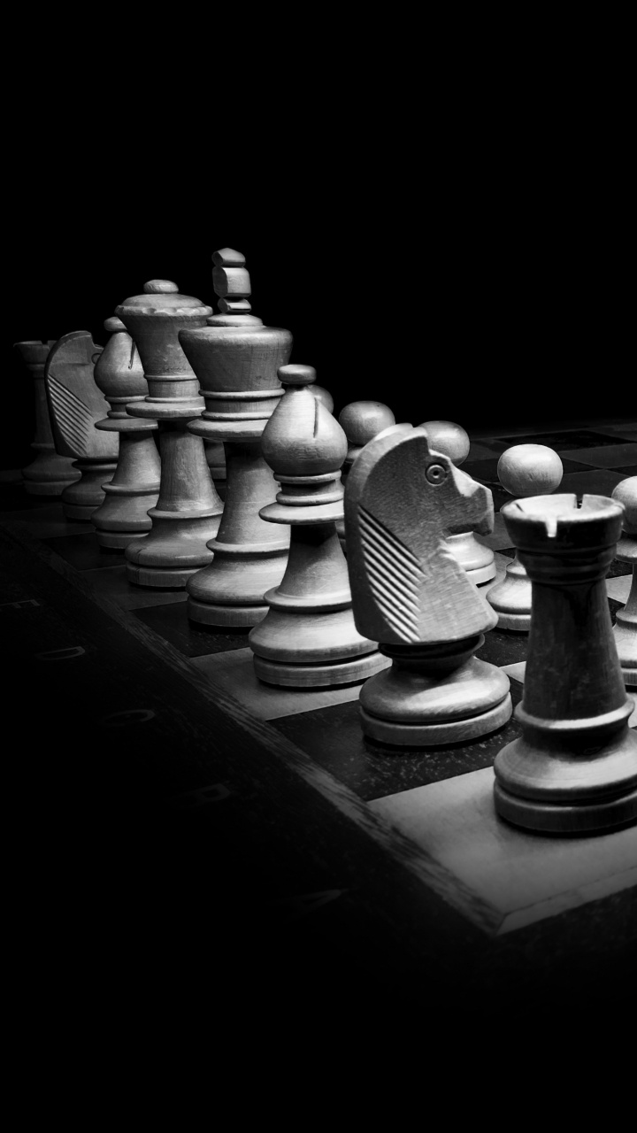 Chess Pieces on Chess Board. Wallpaper in 720x1280 Resolution
