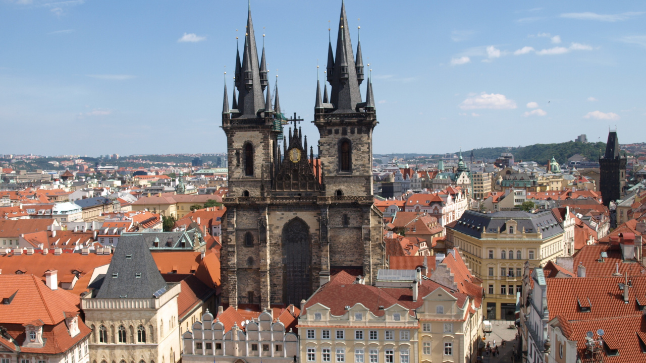 Brown and White Concrete Building Under Blue Sky During Daytime. Wallpaper in 1280x720 Resolution