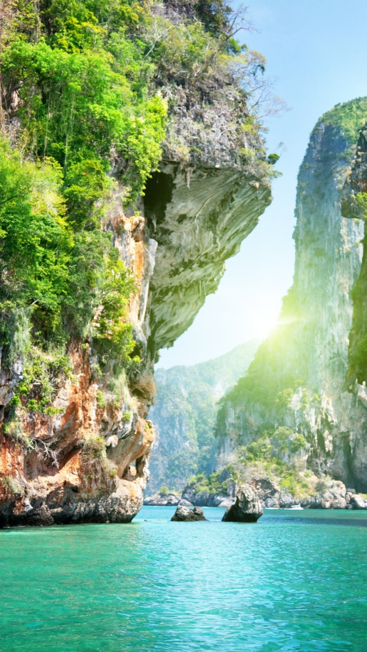 Body of Water Between Rocky Mountain During Daytime. Wallpaper in 750x1334 Resolution