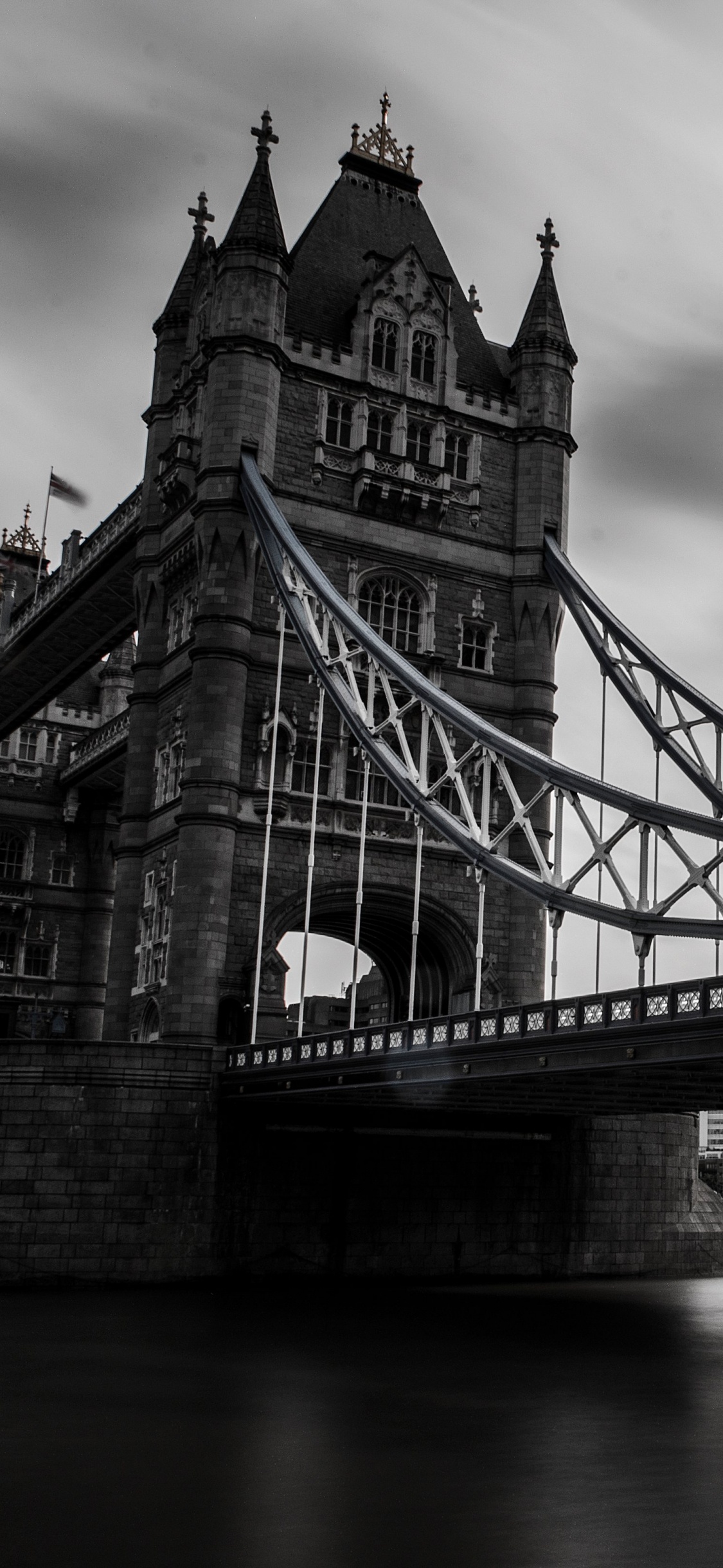 Gray Bridge Under Gray Sky. Wallpaper in 1125x2436 Resolution