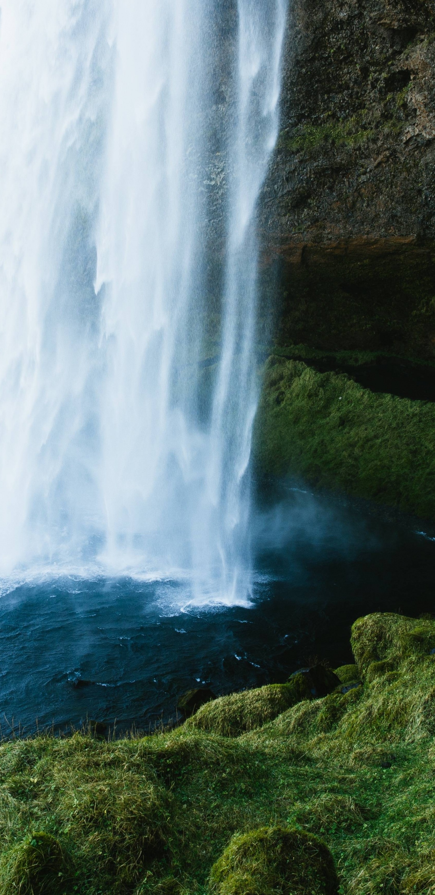 Waterfalls on Green Grass Covered Hill During Daytime. Wallpaper in 1440x2960 Resolution