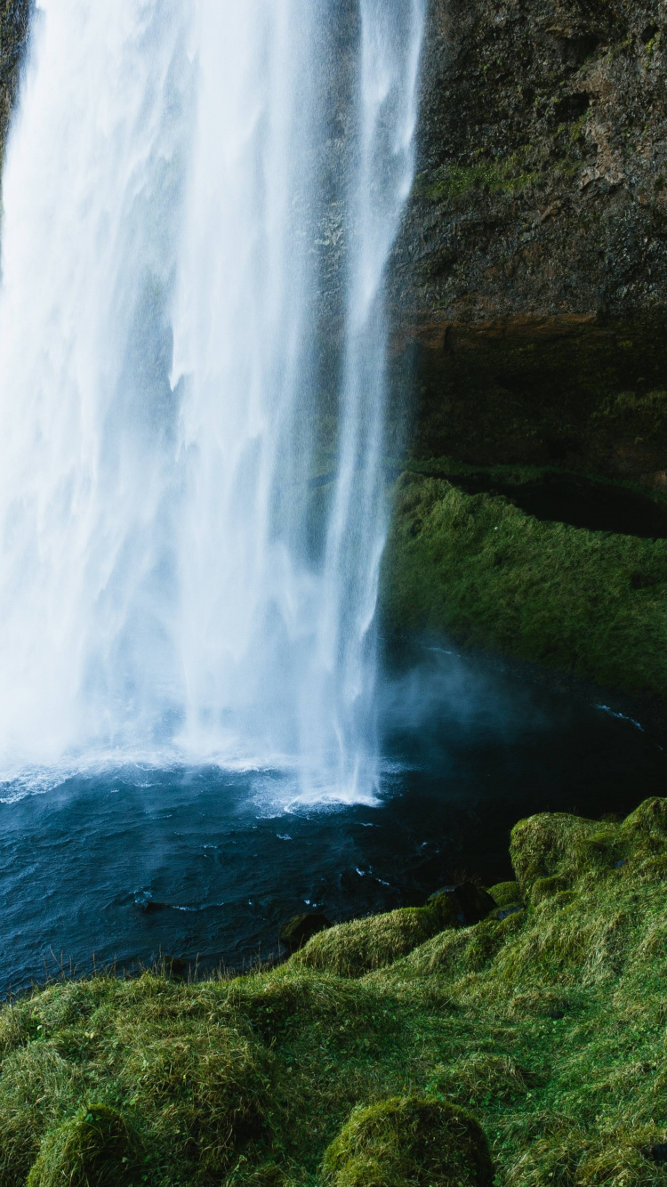 Waterfalls on Green Grass Covered Hill During Daytime. Wallpaper in 750x1334 Resolution