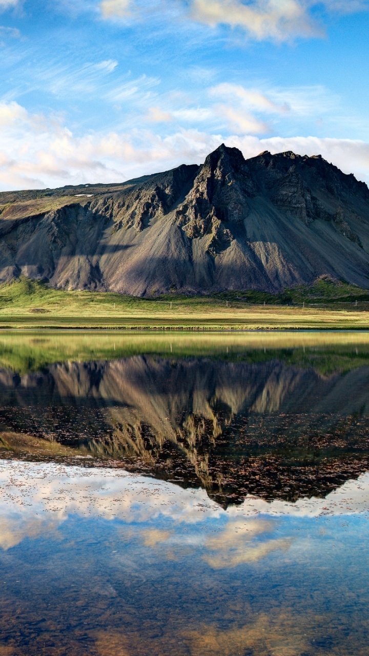 Green and Brown Mountains Beside Lake Under Blue Sky During Daytime. Wallpaper in 720x1280 Resolution