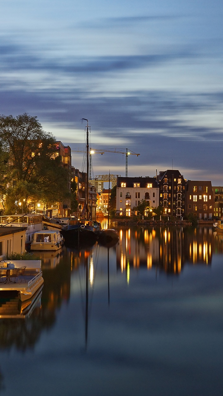 Body of Water Near Green Trees and Buildings During Daytime. Wallpaper in 720x1280 Resolution