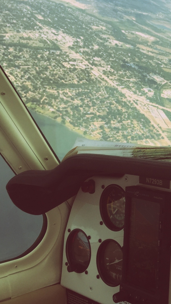 White and Red Airplane Window. Wallpaper in 720x1280 Resolution