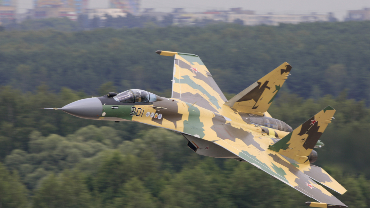 Green and Yellow Fighter Jet Flying Over Green Trees During Daytime. Wallpaper in 1280x720 Resolution