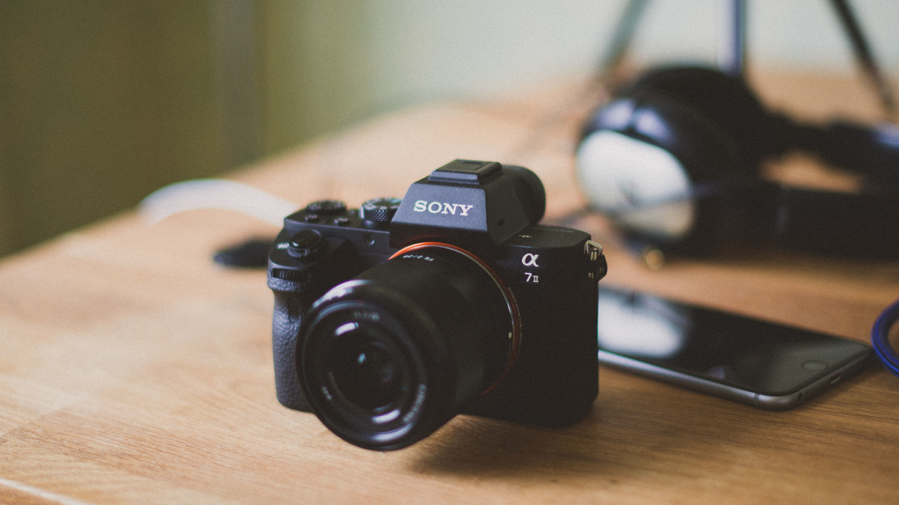 Black Nikon Dslr Camera on Brown Wooden Table. Wallpaper in 1280x720 Resolution
