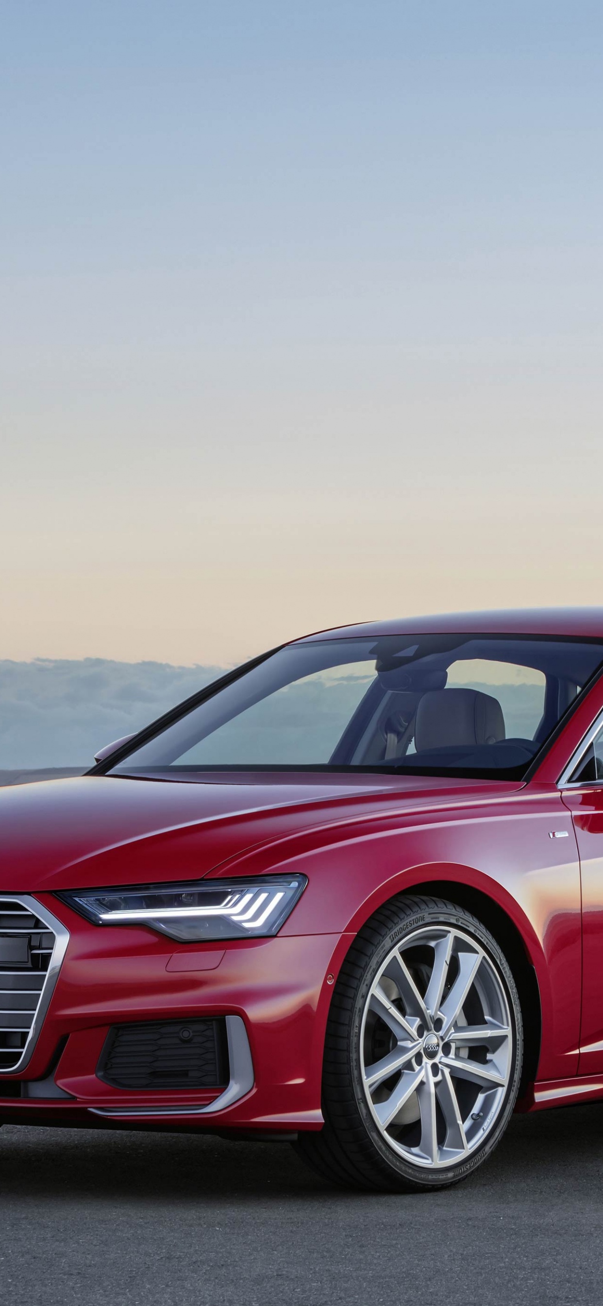 Red Audi a 4 Coupe on Road During Daytime. Wallpaper in 1242x2688 Resolution