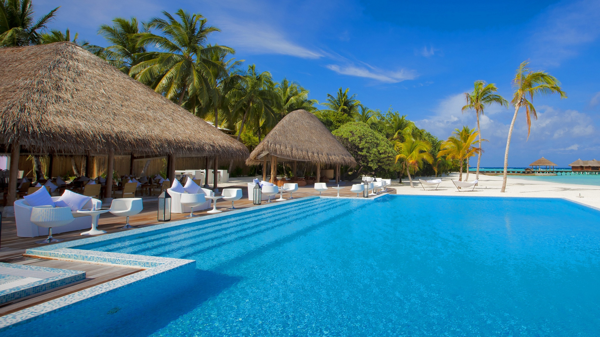 Brown Wooden Beach House Near Swimming Pool During Daytime. Wallpaper in 1920x1080 Resolution