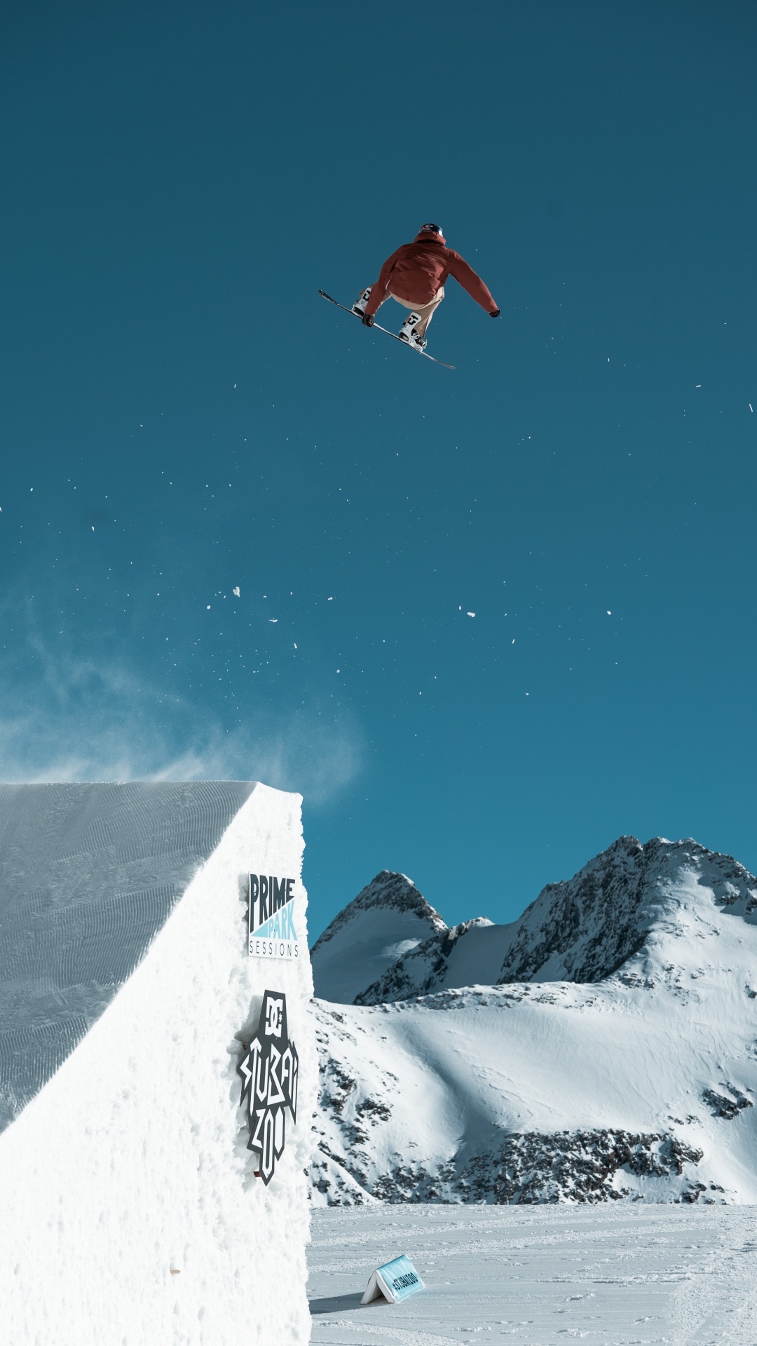 Person in Red Jacket and Black Pants on Snow Covered Mountain During Daytime. Wallpaper in 1080x1920 Resolution