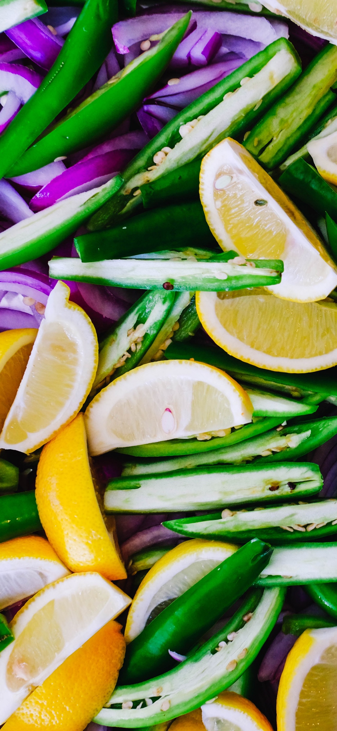 Sliced Lemon and Green Leaves. Wallpaper in 1125x2436 Resolution