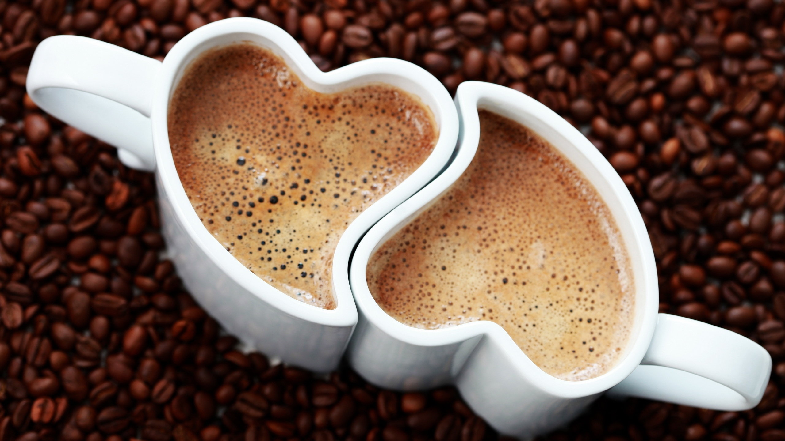 Heart Shaped White Ceramic Container on Brown Coffee Beans. Wallpaper in 2560x1440 Resolution