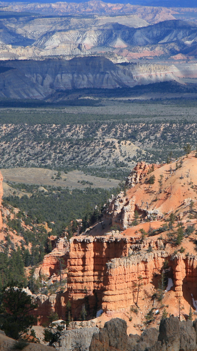Brown Rocky Mountain Under Blue Sky During Daytime. Wallpaper in 750x1334 Resolution