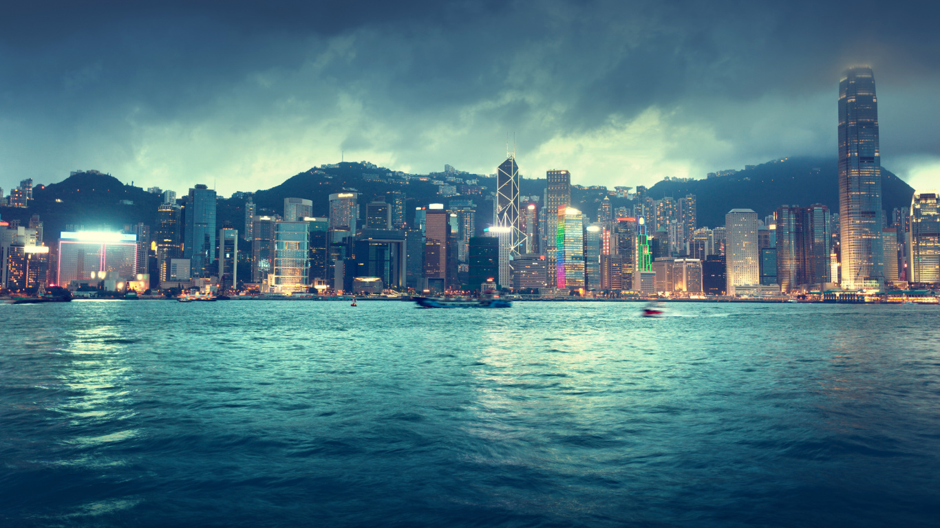 City Skyline Across Body of Water During Night Time. Wallpaper in 1366x768 Resolution